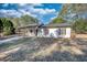 Charming single-story home with a covered porch and a well-maintained front yard at 61 Andrew Rd, Covington, GA 30016