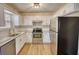 Updated kitchen with stainless steel appliances and granite countertops at 61 Andrew Rd, Covington, GA 30016