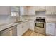 Updated kitchen featuring new stainless appliances, subway tile, and granite counters at 61 Andrew Rd, Covington, GA 30016