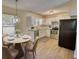 Eat in kitchen featuring modern appliances, granite counters, and white cabinets at 61 Andrew Rd, Covington, GA 30016