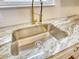 Close-up of a stainless steel sink and granite countertop at 61 Andrew Rd, Covington, GA 30016