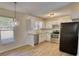 Modern kitchen with stainless steel appliances, white cabinets, and bright lighting at 61 Andrew Rd, Covington, GA 30016