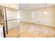 Bright living room features stainless steel appliances and light-colored flooring at 61 Andrew Rd, Covington, GA 30016