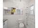 Bright bathroom featuring shower over tub with glass enclosure, modern fixtures, and ample storage at 794 Frederica Ne St # 2, Atlanta, GA 30306