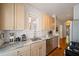 Well-lit kitchen featuring marble countertops, stainless steel appliances, and white subway tile backsplash at 794 Frederica Ne St # 2, Atlanta, GA 30306