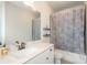 Bathroom with a white sink vanity, tile floors, and a shower-tub combination at 1323 Faircrest Way, Suwanee, GA 30024