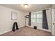 Neutral toned bedroom with natural light and plush carpet at 1323 Faircrest Way, Suwanee, GA 30024