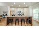 Spacious kitchen with large island, granite countertops, and ample cabinet space at 1323 Faircrest Way, Suwanee, GA 30024
