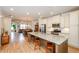 Open-concept kitchen featuring a large island, stainless steel appliances, and hardwood floors at 1323 Faircrest Way, Suwanee, GA 30024