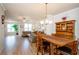 Spacious living area with hardwood floors, and large windows at 1323 Faircrest Way, Suwanee, GA 30024