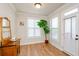 Bright sitting room with neutral walls, hardwood floors, and a large window showcasing the beautiful view at 1323 Faircrest Way, Suwanee, GA 30024