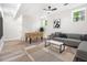 This basement features light wood floors, a foosball table, and a gray sofa with throw pillows at 3185 Hammarskjold Dr, East Point, GA 30344
