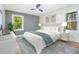 Serene bedroom with neutral tones, plush bedding, and ample natural light streaming through the windows at 3185 Hammarskjold Dr, East Point, GA 30344