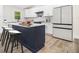 Modern kitchen features stainless steel appliances, a large island, and white cabinetry at 3185 Hammarskjold Dr, East Point, GA 30344