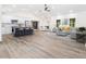Open-concept living space with a modern kitchen, dining area, and comfortable seating at 3185 Hammarskjold Dr, East Point, GA 30344