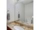 Bathroom with granite countertop, white cabinets and a large mirror at 3795 Soapstone Rd, Decatur, GA 30034