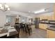 Bright open kitchen with an island, stainless appliances, and seamless flow to the living and dining area at 3795 Soapstone Rd, Decatur, GA 30034