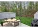 Outdoor patio features a patio table with chairs and a grill in a backyard at 3795 Soapstone Rd, Decatur, GA 30034