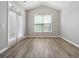 Well-lit dining room with modern lighting, a large window, and access to the outdoor patio at 4114 Bigsage Dr, College Park, GA 30349