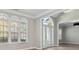 Inviting entryway with hardwood floors, arched windows, and a view into the adjacent living spaces at 4114 Bigsage Dr, College Park, GA 30349