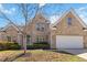 Charming brick home with a well-manicured lawn and a two-car garage, providing ample curb appeal at 4114 Bigsage Dr, College Park, GA 30349