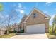 Beautiful exterior view of a well maintained two story brick home with a large driveway and landscaping at 4114 Bigsage Dr, College Park, GA 30349