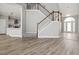 Open foyer featuring hardwood floors, a staircase, and a view of the kitchen and formal living area at 4114 Bigsage Dr, College Park, GA 30349