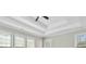 Spacious main bedroom featuring a tray ceiling, ample natural light, and a serene atmosphere for relaxation at 4114 Bigsage Dr, College Park, GA 30349