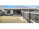 Spacious backyard is fully fenced and features a covered patio space at 515 Vandenburg Dr, Villa Rica, GA 30180