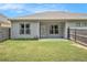 Spacious backyard features a small covered patio and a green lawn at 515 Vandenburg Dr, Villa Rica, GA 30180