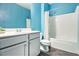 Clean bathroom features a single sink vanity with gray cabinets and a shower-tub combo at 515 Vandenburg Dr, Villa Rica, GA 30180