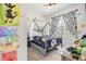 bedroom features unique decor, a window with printed curtains, and playful accents at 515 Vandenburg Dr, Villa Rica, GA 30180