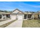 Charming single-story home with a two-car garage and well-maintained lawn at 515 Vandenburg Dr, Villa Rica, GA 30180