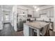Well-lit kitchen featuring stainless steel appliances, gray cabinetry, and an island with seating at 515 Vandenburg Dr, Villa Rica, GA 30180