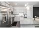Modern kitchen featuring stainless steel appliances, granite countertops, and ample cabinet space at 515 Vandenburg Dr, Villa Rica, GA 30180