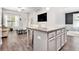 Stylish kitchen island offering seating and a view into the living room at 515 Vandenburg Dr, Villa Rica, GA 30180