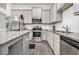 Modern kitchen featuring granite countertops, stainless steel appliances and shaker cabinets at 515 Vandenburg Dr, Villa Rica, GA 30180