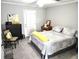 Bright bedroom with a queen-size bed, large window, and stylish decor, creating a welcoming and relaxing retreat at 703 Gettysburg Pl, Atlanta, GA 30350