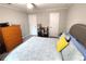 Comfortable bedroom with a queen-size bed, soft carpet, and neutral colors, creating a serene and inviting space at 703 Gettysburg Pl, Atlanta, GA 30350