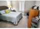 Comfortable bedroom with a queen-size bed, soft carpet, and neutral colors, creating a serene and inviting space at 703 Gettysburg Pl, Atlanta, GA 30350