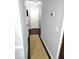 Hallway features dark floors, neutral wall color, and a textured rug at 703 Gettysburg Pl, Atlanta, GA 30350