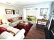 Comfortable living room with a fireplace and access to a sunroom at 703 Gettysburg Pl, Atlanta, GA 30350
