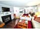 Cozy living room featuring a fireplace, hardwood floors, and comfortable seating at 703 Gettysburg Pl, Atlanta, GA 30350