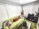 Cozy sunroom features large windows, comfortable seating, and decorative accents, perfect for relaxation and enjoying natural light at 703 Gettysburg Pl, Atlanta, GA 30350