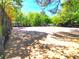 Outdoor tennis court for active recreation, surrounded by lush greenery at 703 Gettysburg Pl, Atlanta, GA 30350