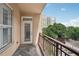 Balcony showcasing views of neighborhood and foliage in the background at 1101 Juniper Ne St # 415, Atlanta, GA 30309