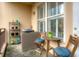 Cozy balcony features a small dining set, potted plants, and tranquil natural light from the exterior at 1101 Juniper Ne St # 415, Atlanta, GA 30309