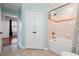 Bathroom featuring tub-shower, toilet, and access to an adjacent bedroom at 1101 Juniper Ne St # 415, Atlanta, GA 30309