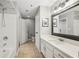 Bathroom featuring an extended vanity, a framed mirror, and a shower/tub combo at 1101 Juniper Ne St # 415, Atlanta, GA 30309