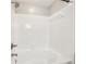 Bright bathroom featuring a tub with white tile surround and a shower head at 1101 Juniper Ne St # 415, Atlanta, GA 30309